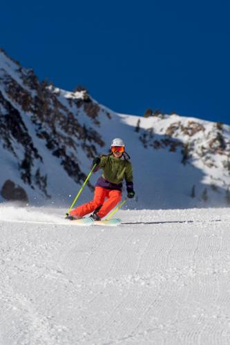 Ski tester, Krista Crabtree, arcs in Mineral Basin area at Snowbird, Utah.